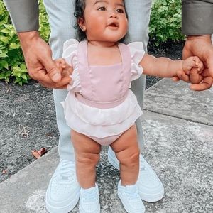 SOLD EUC Bailey’s Blossoms Lavender Ruffle Peplum Bubble Romper 6-9 months